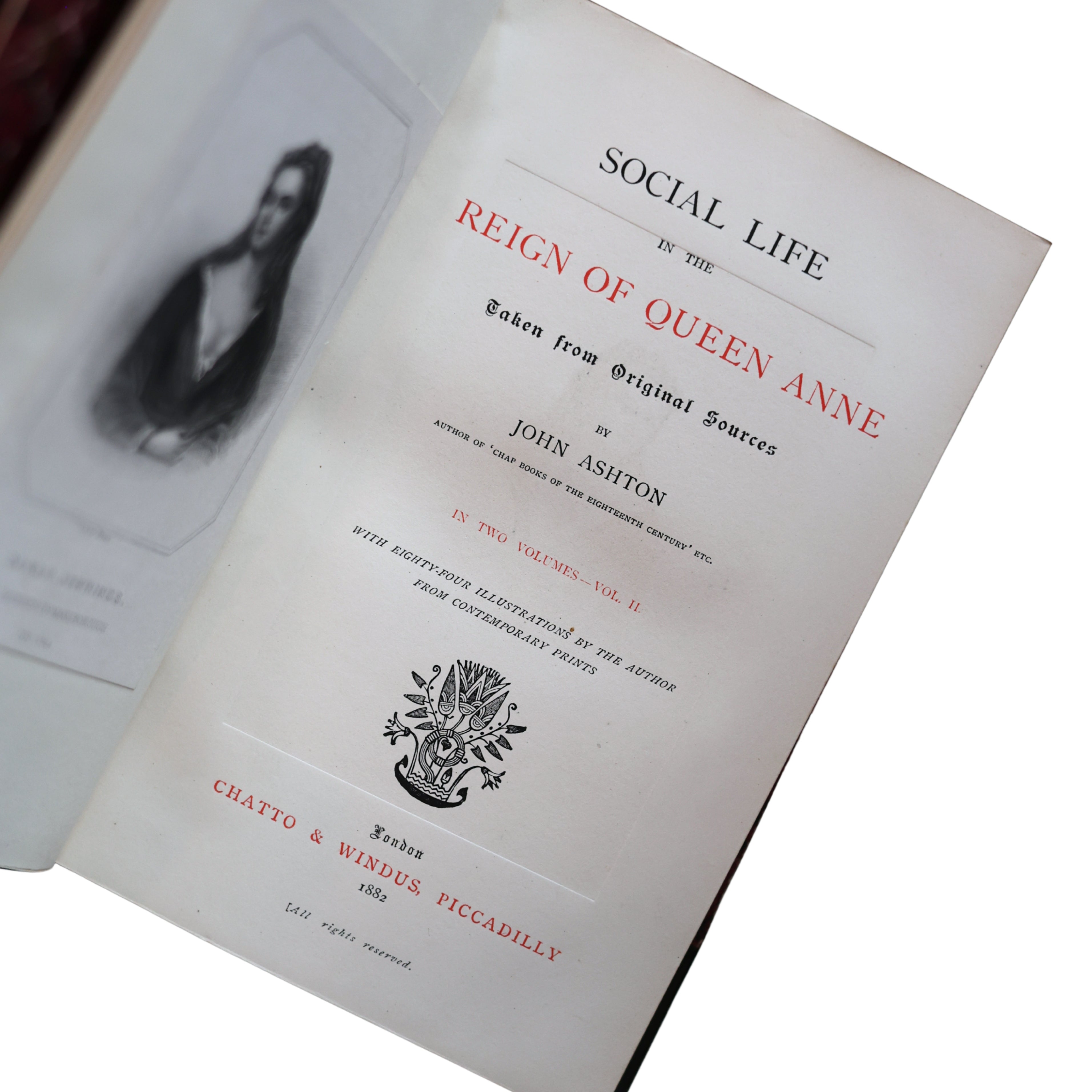 Book titled 'Social Life in the Reign of Queen Anne' by John Ashton on a white background